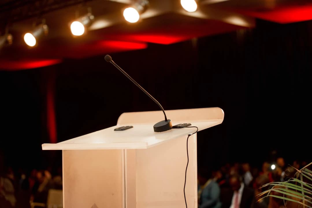 the podium with a mic on stage